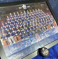 Framed centennial team photo with included Mats Sundin puck