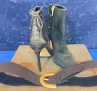 Front and rear view of boots with belt foreground
