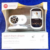 Front of sealed retail box displaying camera and parent unit