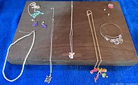 Overview of all jewellery pieces laid out on board