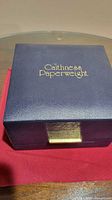 Navy presentation box with gold Caithness Paperweight lettering