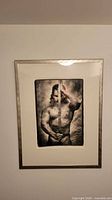 Frontal view of framed photograph showing subject, mat and frame