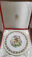 Plate in satin-lined box showing design and crest