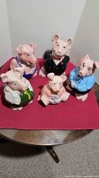 Front view of all five character piggy banks