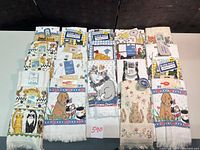 All twenty towels laid out showing fronts and tags