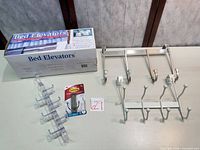 Boxed bed risers, over-door hanger, wall rack, loop hanger, packaged Command hook