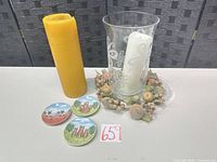 Group shot of all items: vase, two candles, wreath, three cat dishes