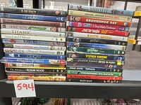 Two vertical stacks showing full lot of 31 DVD cases