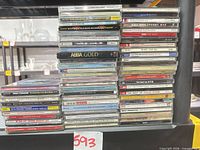 Full view of two stacks showing approximately 60 jewel case CDs