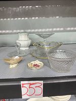 All six pieces grouped on shelf
