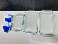 All items: three glass dishes and two packaged silicone grabbers