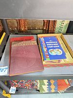Shelf view showing Paragon album, American Album, Brookfield booklet tray