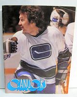 Front cover showing player John Grisdale in Canucks jersey