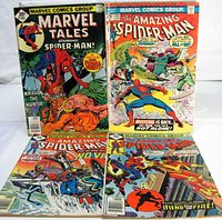 Group shot of all four comic issues front covers visible