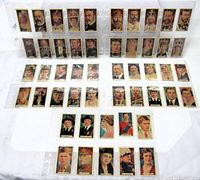 Overview of all 50 Ardath Silver Jubilee portrait tobacco cards in plastic sleeves