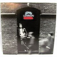 Front cover showing Lennon doorway image with neon title