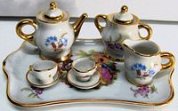 Full set displayed on tray showing all ten pieces and decorative details