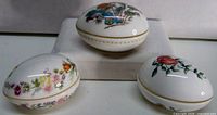 Three Wedgwood porcelain trinket/egg boxes, showing patterns and shapes