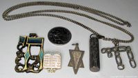 Front view of chain and five Judaica pieces