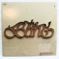 Front cover of The Band Anthology LP showing logo on textured beige background, hole punch visible
