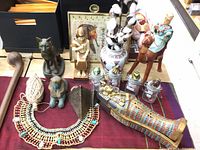 Overview of Egyptian replica artifacts on table