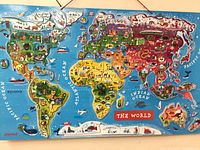 Full view of Janod world map puzzle hanging