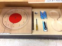 Overall view of wooden clock board and accessory tray