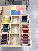 Top view of full tray showing tablets arranged by hue and included color wheel