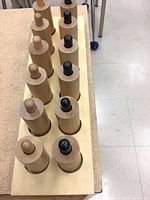 Complete set of 10 cylinders inserted in storage board