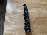 Front view of entire argillite stone totem pole