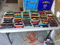 Full table view of 58 HO scale train pieces