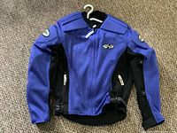 Front view of blue/black Joe Rocket Ballistic Series jacket on hanger