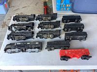 Group view of 12 Lionel trains on table