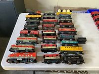 Full lot overview showing two locomotives and multiple freight cars laid out on table