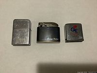 Group image of Ronson Wind II lighter, Homey Farm lighter, Zippo tape measure