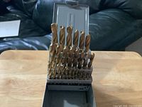Open case showing full set of drill bits
