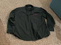 Front view of black Harley-Davidson long sleeve button-up shirt showing chest embroidery and overall condition