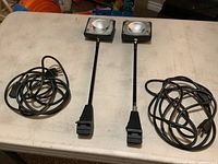 Pair of display lights with cords laid out
