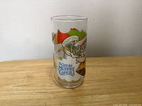 Front view of glass showing Kermit graphic and title text