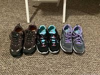 Three pairs of women’s running shoes side by side