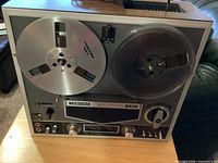 Front view showing brand, model, reels, control panel