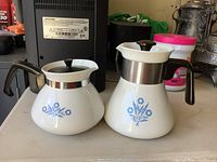 Both Corning Ware Blue Cornflower teapots front view