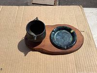 Top view of assembled ashtray set on wood base