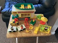 Overview of camper, boat, vehicles, playground pieces and figures