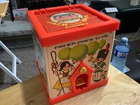 Front and left sides of box with graphics and foot pedal
