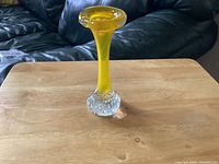 Full view of amber Aseda bone vase on table