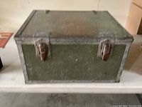 Front view showing twin steel latches and overall trunk condition