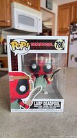 Front view of boxed Funko Pop #780 LARP Deadpool figure