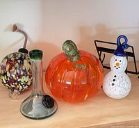 group shot showing all four glass items on shelf