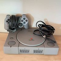 Front and accessories view showing console, controller, cables